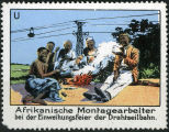 Afrikanische Montagearbeiter bei der Einweihungsfeier der Drahtseilbahn. 